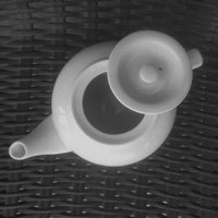 top view of a White Porcelain Tea Pot with the lid open