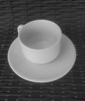 slightly tilted top view of White Porcelain Tea Cup and Saucer