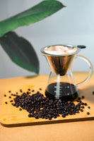 Sagada Arabica Blend coffee beans alongside a coffee brew flask